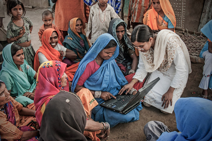 https://1ngo.sgp1.digitaloceanspaces.com/media/sadana/Indian-village-women-learning-to-use-a-laptop-1.jpg